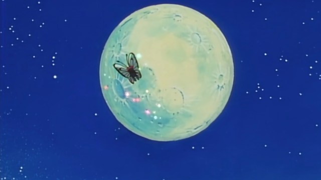 A Butterfree flies through the night sky in the Pokemon anime